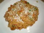 Risotto mit getrockneten Tomaten und Basilikum